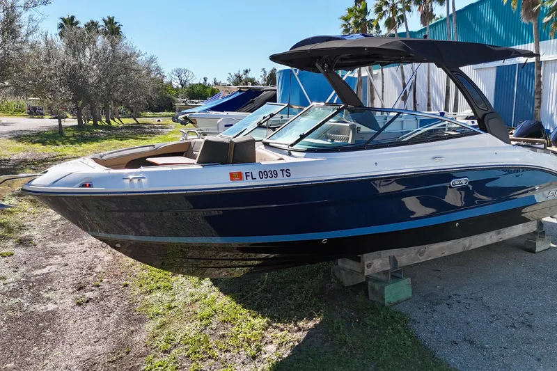 Slide: The Image of 2024 Sea Ray SLX 280 Outboard boat on display, parked outdoors. - 3