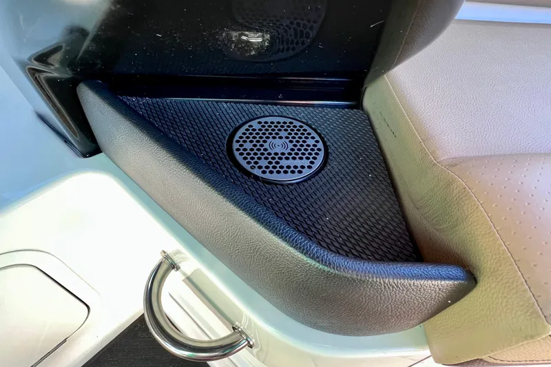 Slide: The Image of 2024 Sea Ray SLX 280 Outboard interior detail with speaker and leather seating. - 31