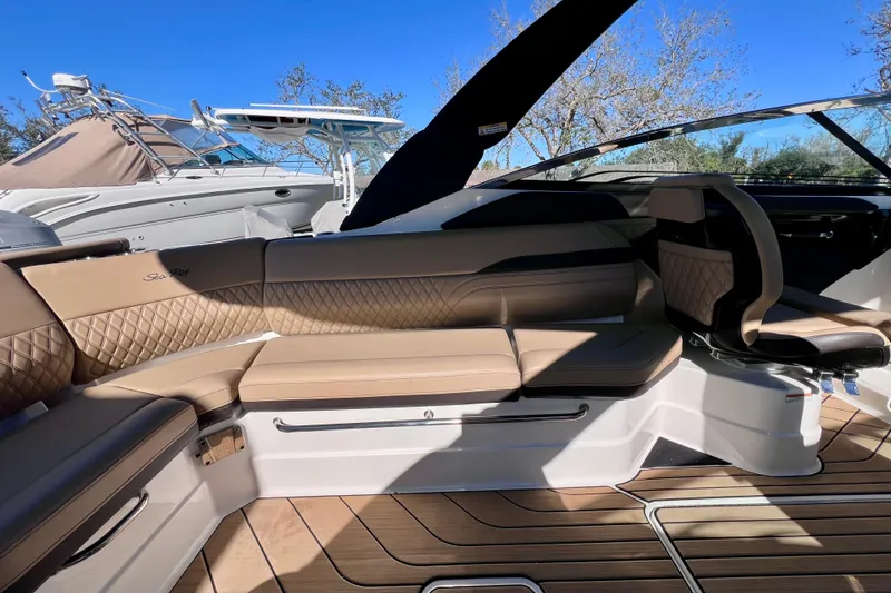Slide: The Image of 2024 Sea Ray SLX 280 Outboard interior with luxurious seating and elegant design. - 32