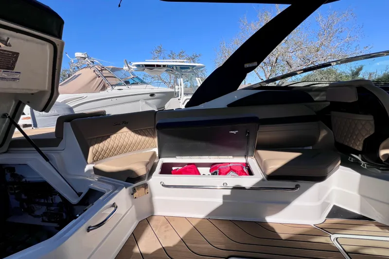 Slide: The Image of 2024 Sea Ray SLX 280 Outboard interior with seating and storage compartments. - 33
