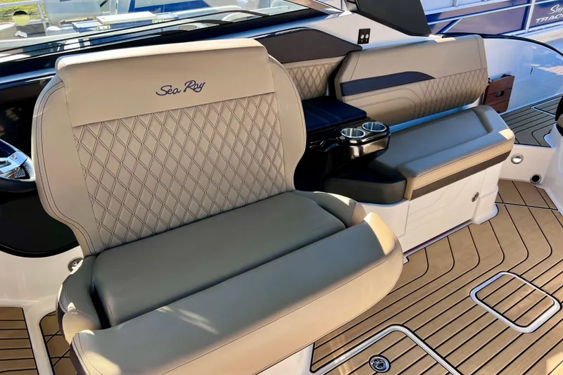 Slide: The Image of 2024 Sea Ray SLX 280 Outboard interior with luxurious seating and cup holders. - 46