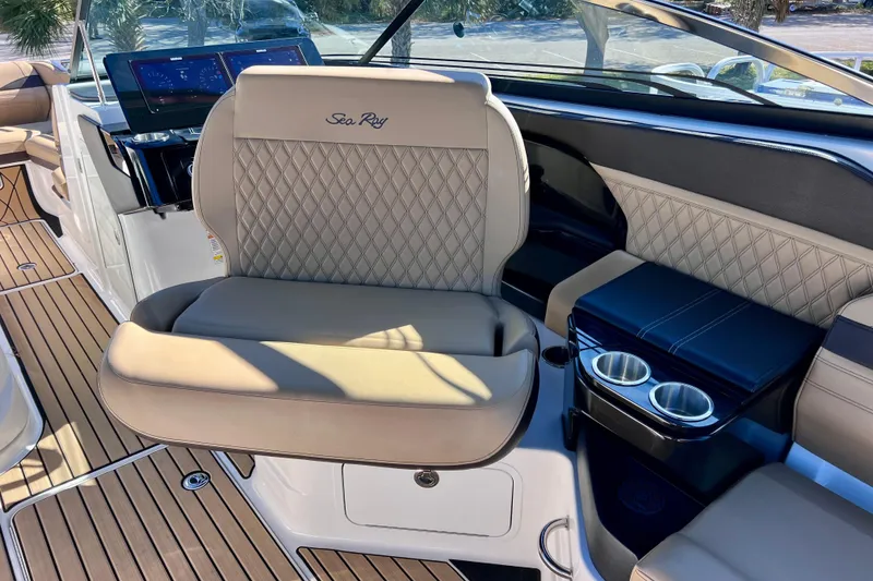 Slide: The Image of 2024 Sea Ray SLX 280 Outboard interior with luxurious seating and modern dashboard. - 47