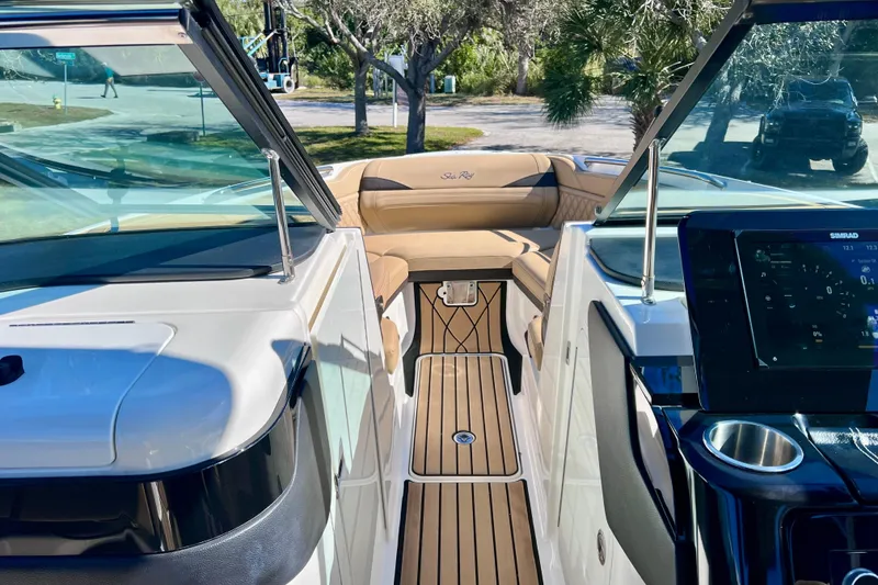 Slide: The Image of 2024 Sea Ray SLX 280 Outboard interior with luxurious seating and modern dashboard. - 63
