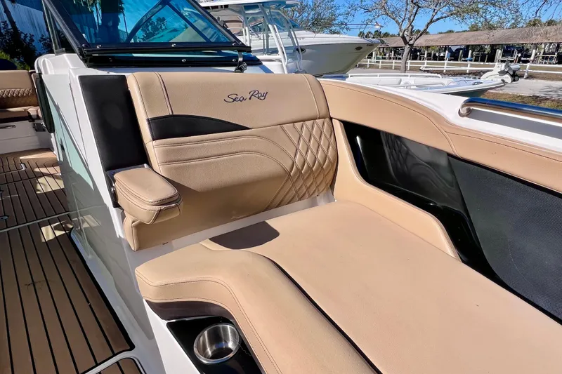 Slide: The Image of 2024 Sea Ray SLX 280 Outboard boat with luxurious tan seating and elegant design. - 67