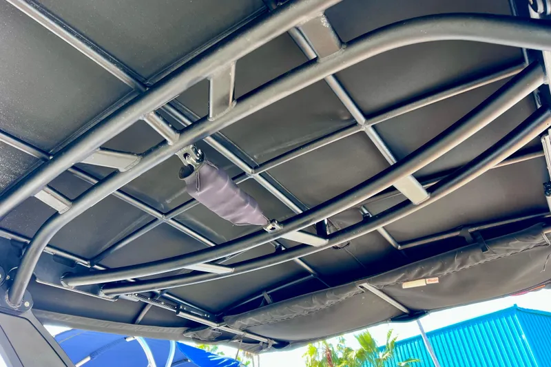 Slide: The Image of 2024 Sea Ray SLX 280 Outboard boat canopy frame, showcasing sturdy construction. - 77