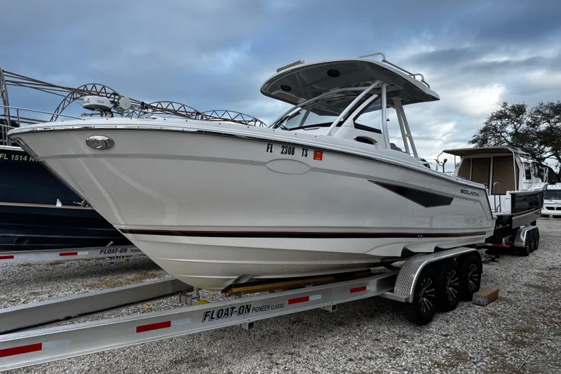 Slide: The Image of 2024 Solara S-250 CW boat on trailer, ready for transport. - 2