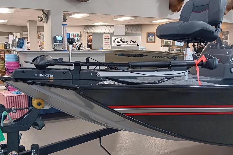 Slide: The Image of 2026 Tracker Bass Tracker Classic XL boat with Minn Kota Edge motor in showroom. - 7