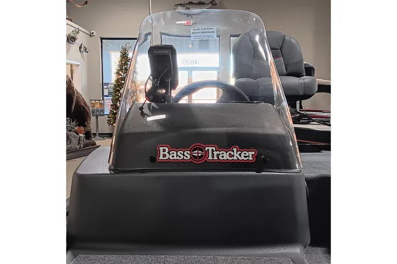 Slide: The Image of 2026 Tracker Bass Tracker Classic XL boat console with Garmin device, indoor display. - 9