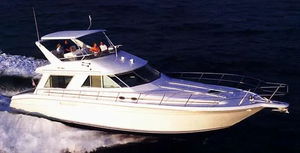 The Image of 1998 Sea Ray 550 Sedan Bridge on turquoise water. - 0