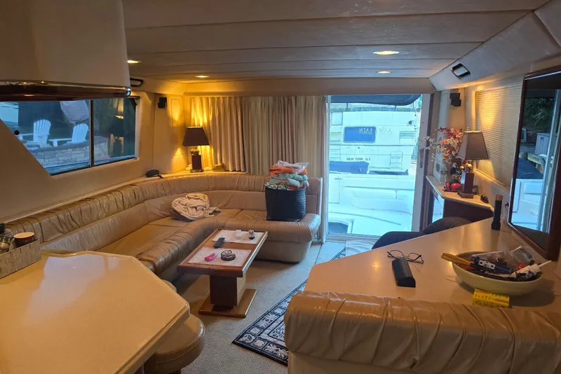 Slide: The Image of Luxurious interior of 1998 Sea Ray 550 Sedan Bridge yacht with spacious seating. - 10