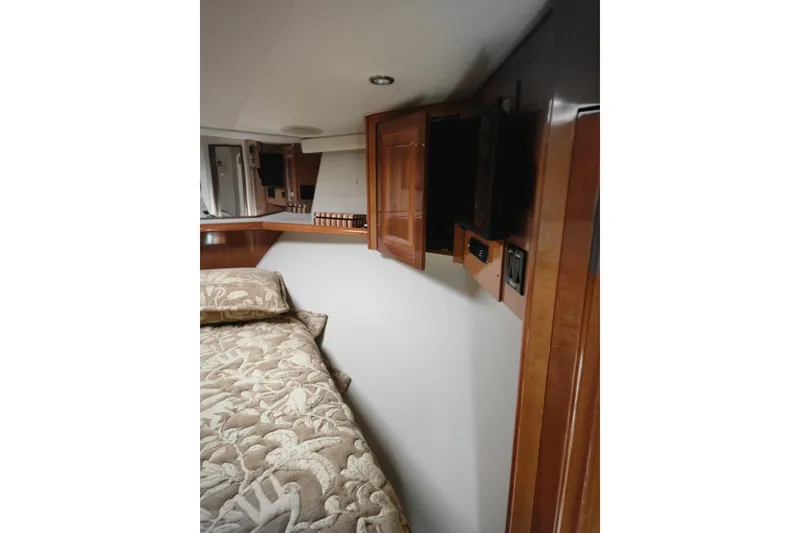 Slide: The Image of Luxurious interior of a 1998 Sea Ray 550 Sedan Bridge yacht with elegant seating and decor. - 16