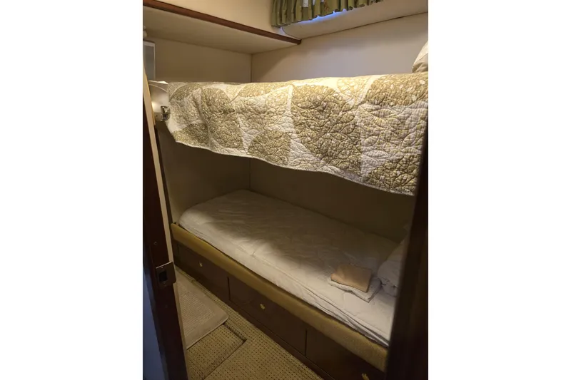 Slide: The Image of Luxurious interior of a 1998 Sea Ray 550 Sedan Bridge yacht with elegant seating and decor. - 17