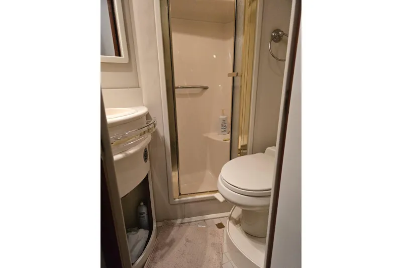 Slide: The Image of Luxurious interior of 1998 Sea Ray 550 Sedan Bridge yacht with elegant seating and decor. - 18