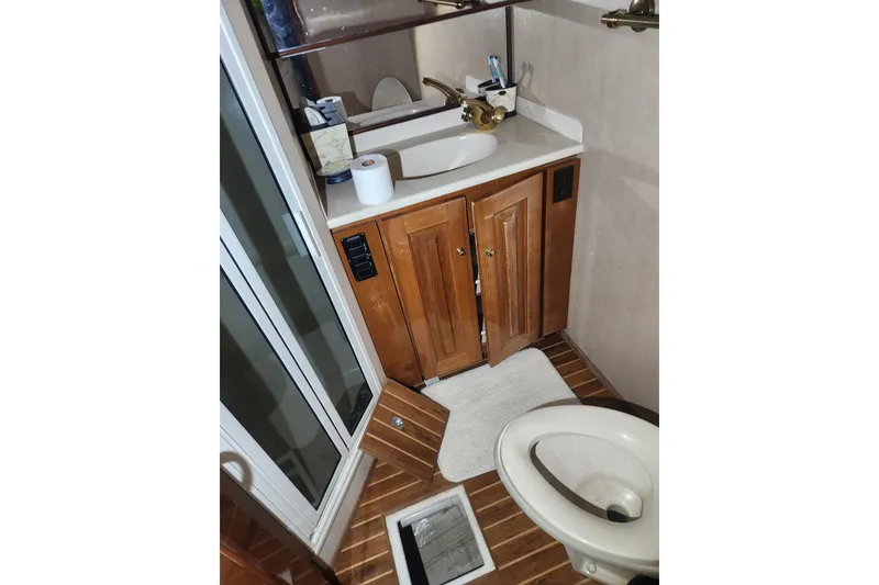 Slide: The Image of Luxurious interior of a 1998 Sea Ray 550 Sedan Bridge yacht with elegant seating. - 20