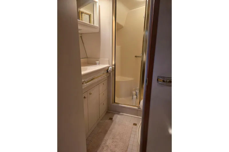 Slide: The Image of Interior of 1998 Sea Ray 550 Sedan Bridge yacht, featuring cozy seating and elegant decor. - 21