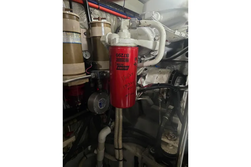 Slide: The Image of 1998 Sea Ray 550 Sedan Bridge cabin interior with open wardrobe and drawers. - 45