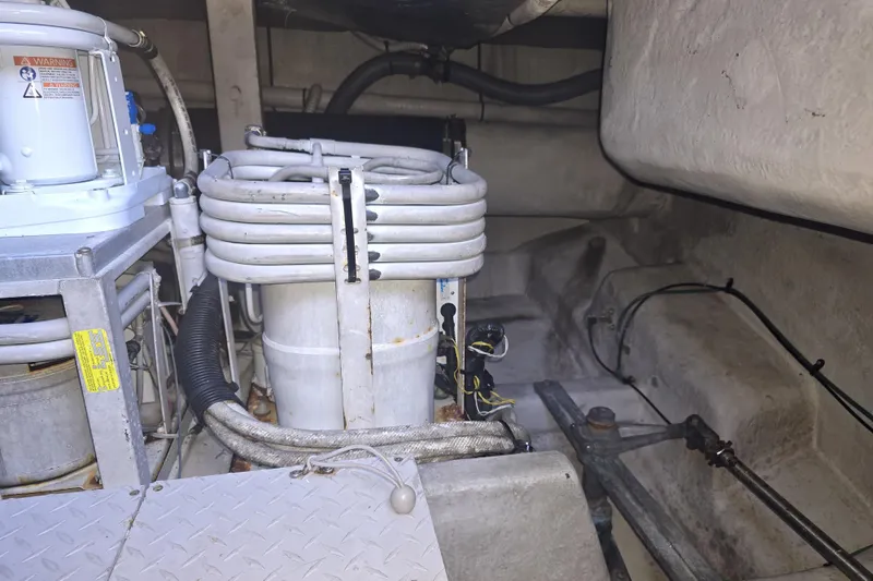 Slide: The Image of 1998 Sea Ray 550 Sedan Bridge interior closet with shoes and hanging bag. - 46