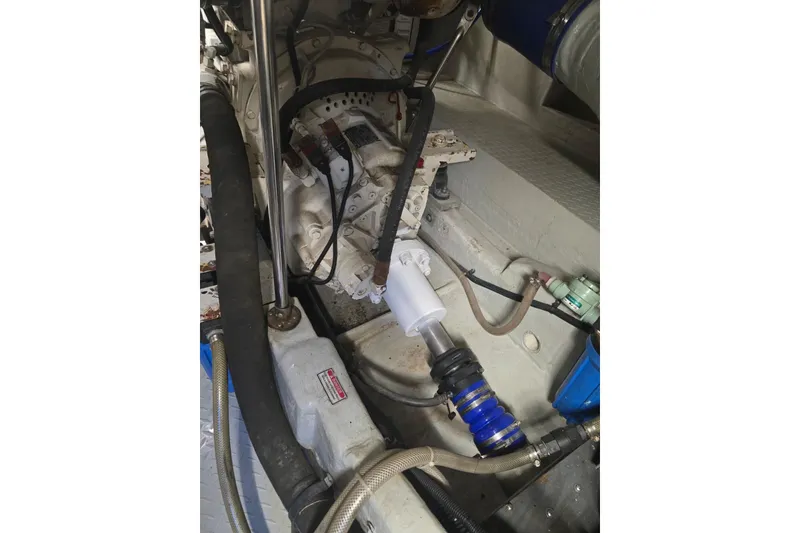 Slide: The Image of Engine room of a 1999 Sea Ray 550 Sedan Bridge with electrical components and wiring. - 50