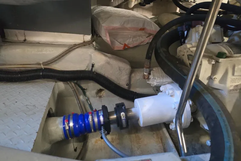 Slide: The Image of 1999 Sea Ray 550 Sedan Bridge battery compartment with Interstate marine batteries and control panel. - 57