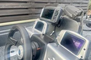 Slide: The Image of 2026 Tracker Pro Team 175 Crappie Edition boat dashboard with modern navigation equipment. - 2