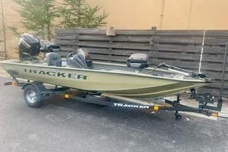 Slide: The Image of 2026 Tracker Pro Team 175 Crappie Edition boat on trailer, parked outdoors. - 3