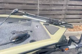 Slide: The Image of 2026 Tracker Pro Team 175 Crappie Edition boat with trolling motor and carpeted deck. - 4