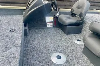 Slide: The Image of 2026 Tracker Pro Team 175 Crappie Edition boat interior with seating and steering console. - 8