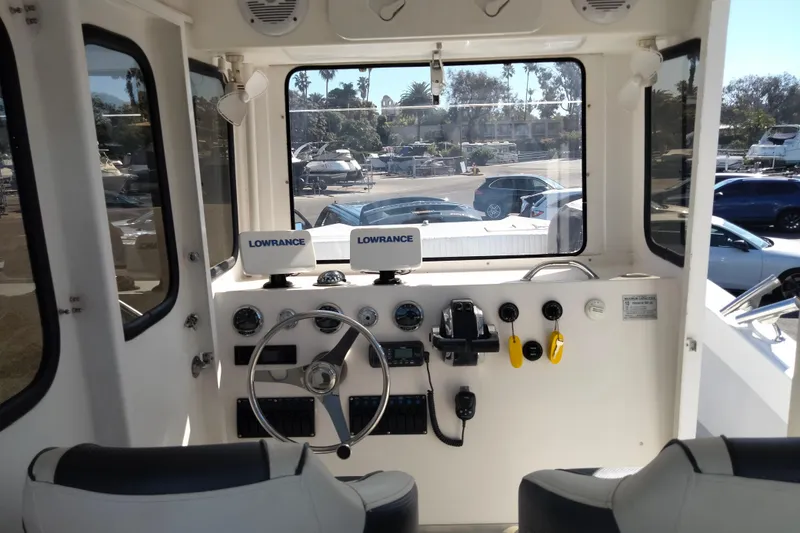 Slide: The Image of Interior view of 2021 Custom Pilot House Catamaran cockpit with navigation equipment. - 17