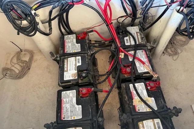 Slide: The Image of Battery setup in 2021 28 Custom Line Pilot House Catamaran, featuring multiple connected units. - 6