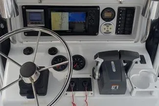 Slide: The Image of Glacier Bay 260 Canyon Runner 2000 dashboard with steering wheel and navigation controls. - 11