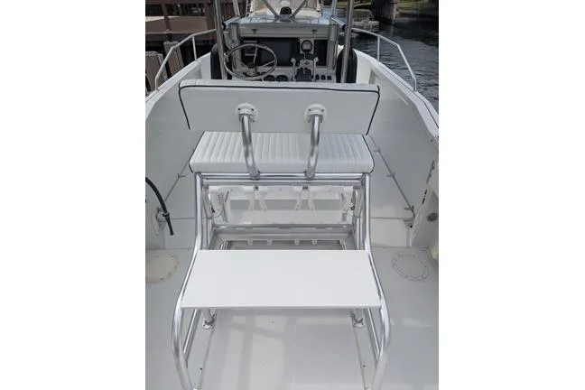 Slide: The Image of 2000 Glacier Bay 260 Canyon Runner boat interior with helm and seating area. - 13