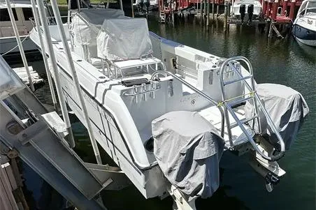 Slide: The Image of 2000 Glacier Bay 260 Canyon Runner boat docked in marina. - 17