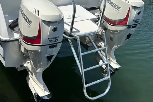 Slide: The Image of 2000 Glacier Bay 260 Canyon Runner with twin Evinrude 150 engines and swim ladder. - 19