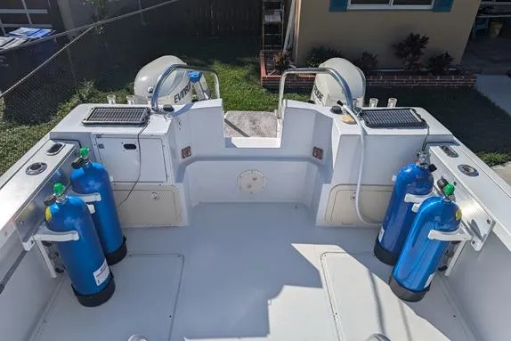 Slide: The Image of 2000 Glacier Bay 260 Canyon Runner boat with scuba tanks and dual outboard motors. - 22