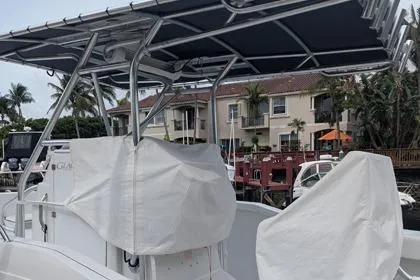 Slide: The Image of 2000 Glacier Bay 260 Canyon Runner boat docked near waterfront homes. - 25