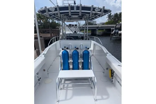 Slide: The Image of 2000 Glacier Bay 260 Canyon Runner boat with dive tanks on deck. - 26