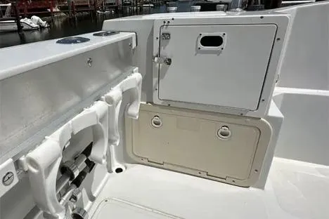 Slide: The Image of 2000 Glacier Bay 260 Canyon Runner boat interior with storage compartments. - 27