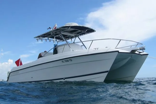 Slide: The Image of 2000 Glacier Bay 260 Canyon Runner boat on open water, side view. - 7