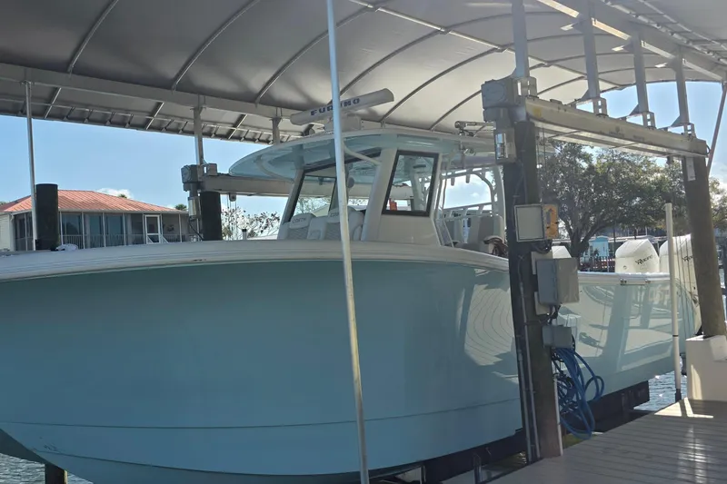 Slide: The Image of 2024 Costa Custom Boats 34 SV with quad Mercury Racing 400 engines at dock. - 18