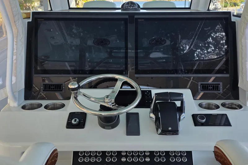 Slide: The Image of 2024 Costa Custom Boats 34 SV interior with luxurious seating and powerful engines. - 19