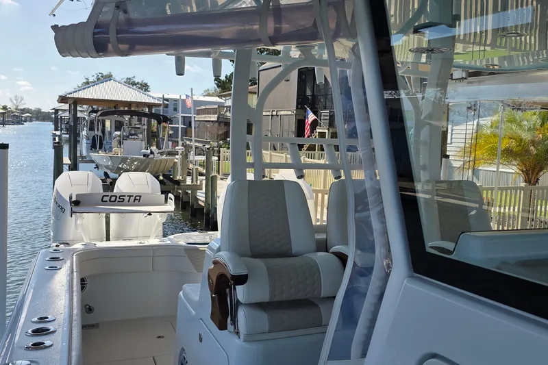 Slide: The Image of Twin Mercury Racing 400 outboard engines on a 2024 Costa Custom Boats 34 SV. - 22