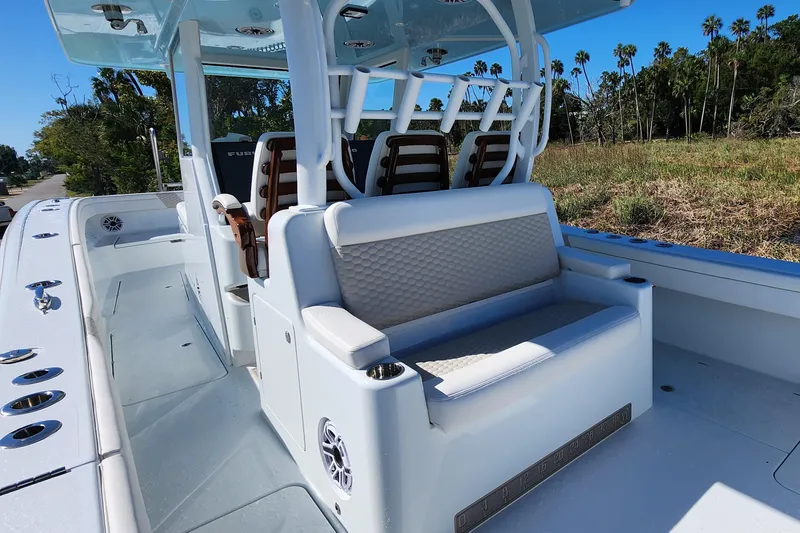 Slide: The Image of 2024 Costa Custom Boats 34 SV with quad engines, parked on a trailer. - 3