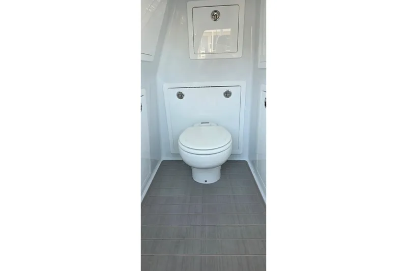 Slide: The Image of 2024 Costa Custom Boats 34 SV interior bathroom with modern toilet and sleek design. - 40