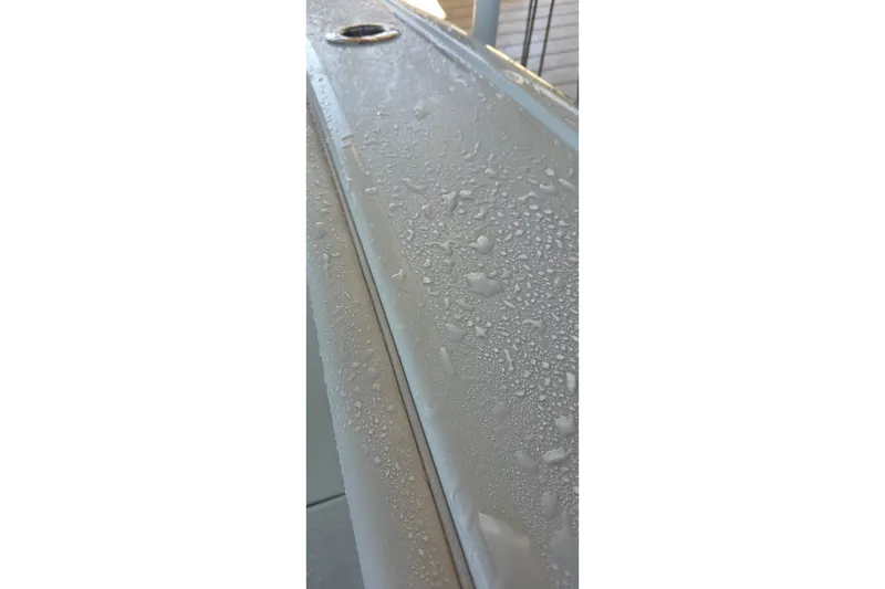Slide: The Image of 2024 Costa Custom Boats 34 SV with water droplets on the surface. - 46