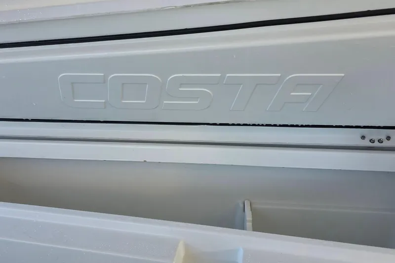 Slide: The Image of 2024 Costa Custom Boats 34 SV, embossed logo detail on white surface. - 53