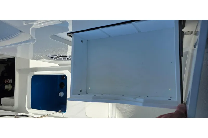 Slide: The Image of 2024 Costa Custom Boats 34 SV interior storage compartment detail. - 56
