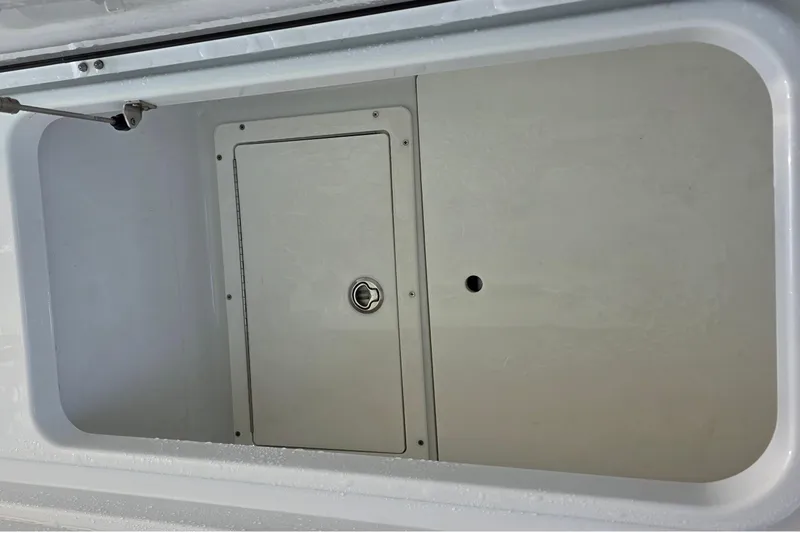 Slide: The Image of Storage compartment of 2024 Costa Custom Boats 34 SV, featuring a secure latch. - 58