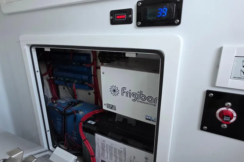 Slide: The Image of Electrical system of 2024 Costa Custom Boats 34 SV with Frigibar refrigeration unit. - 63