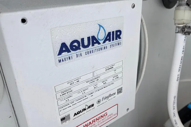 Slide: The Image of Aqua Air marine air conditioning system on 2024 Costa Custom Boats 34 SV. - 65