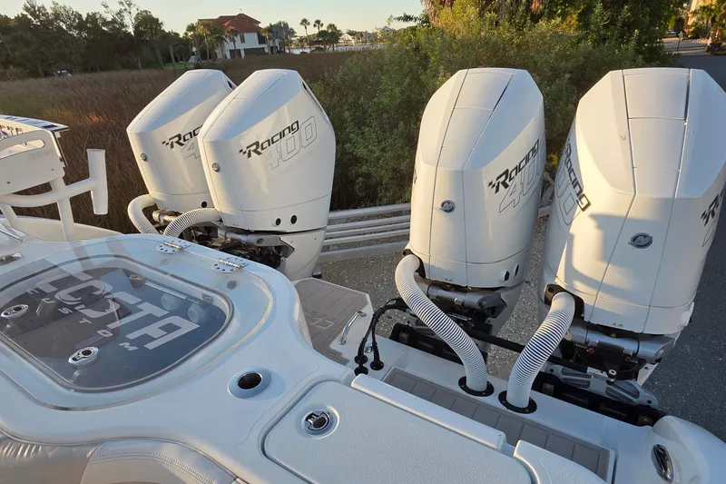 Slide: The Image of 2024 Costa Custom Boats 34 SV helm with dual screens and modern controls. - 8